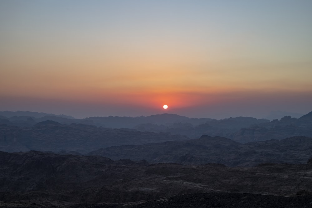 silhouette of mountains during sunset