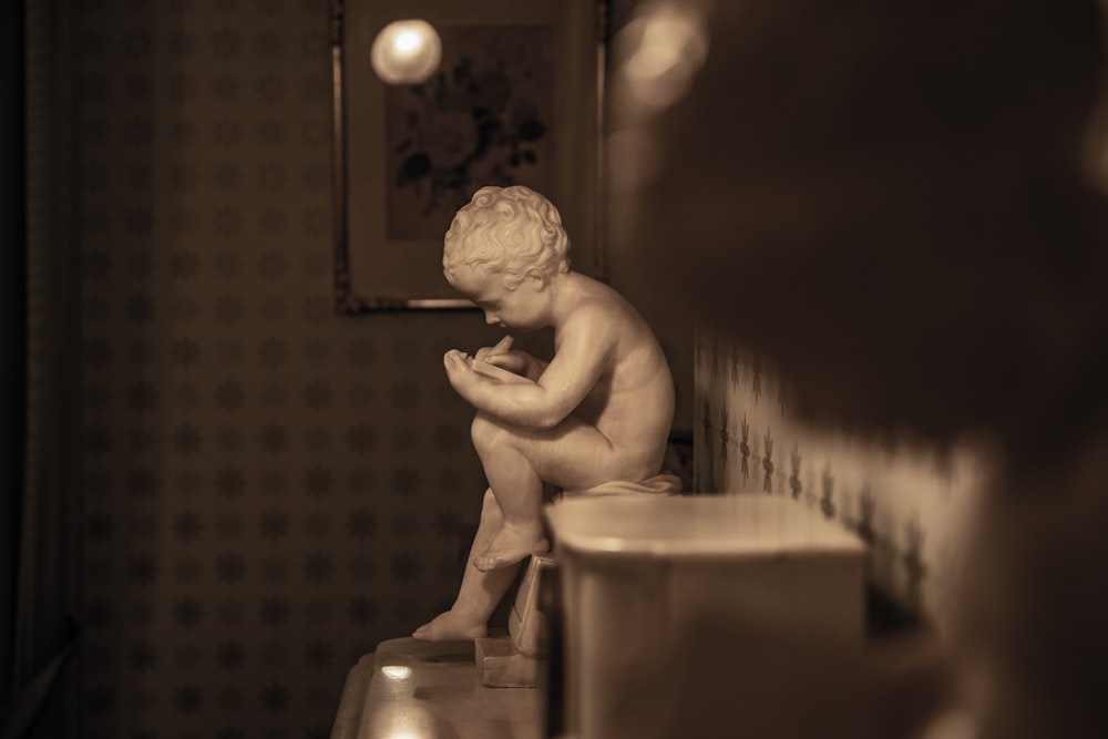 white ceramic statue on table