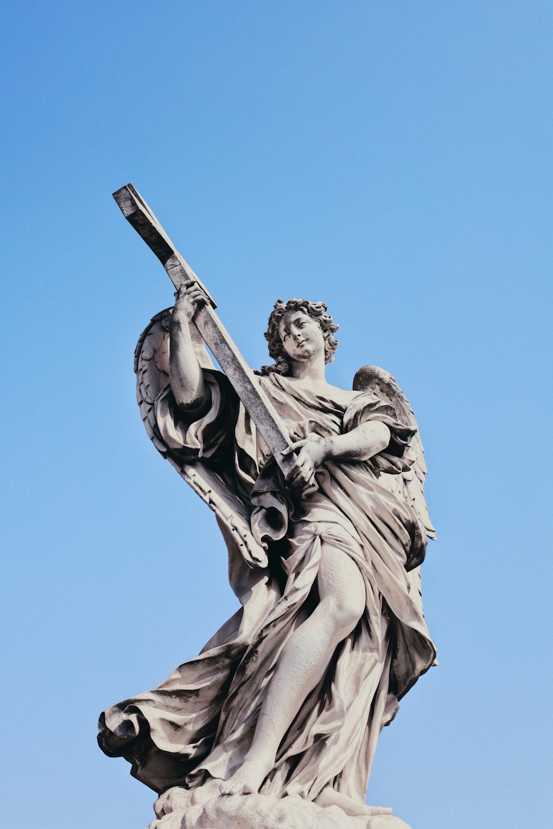 man holding a sword statue