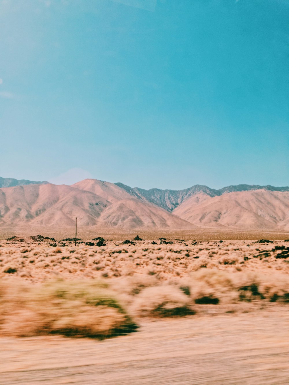 brown mountains under blue sky during daytime