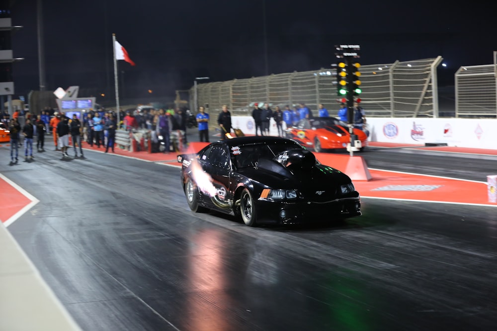 black porsche 911 on track field