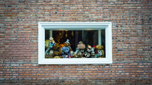 A cozy display of various plush bears in the store.