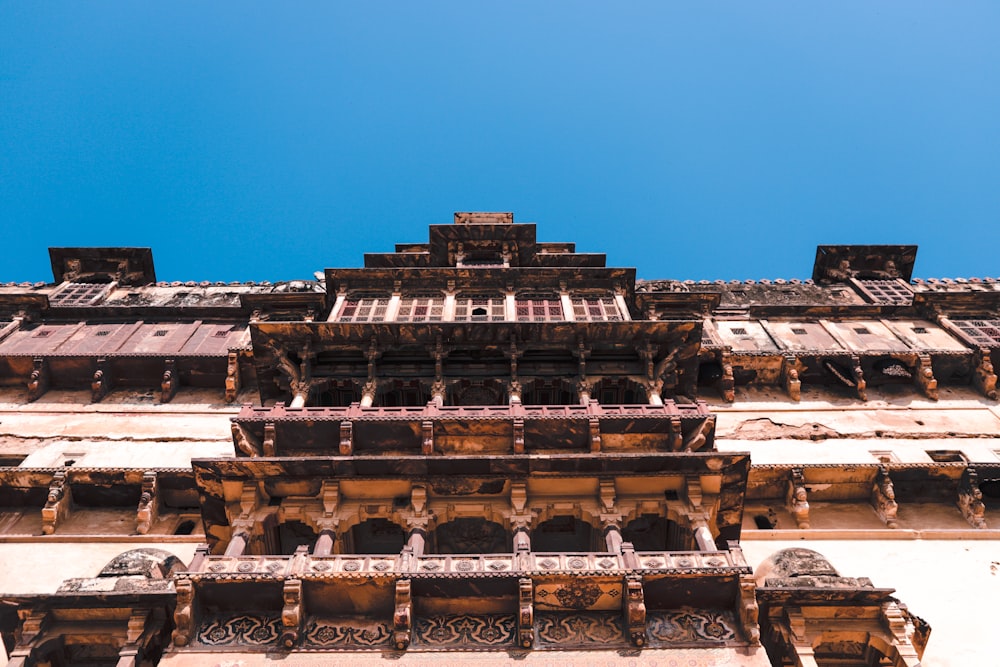 brown concrete building under blue sky during daytime