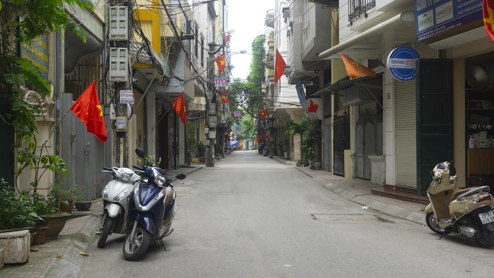 black motorcycle parked on sidewalk during daytime