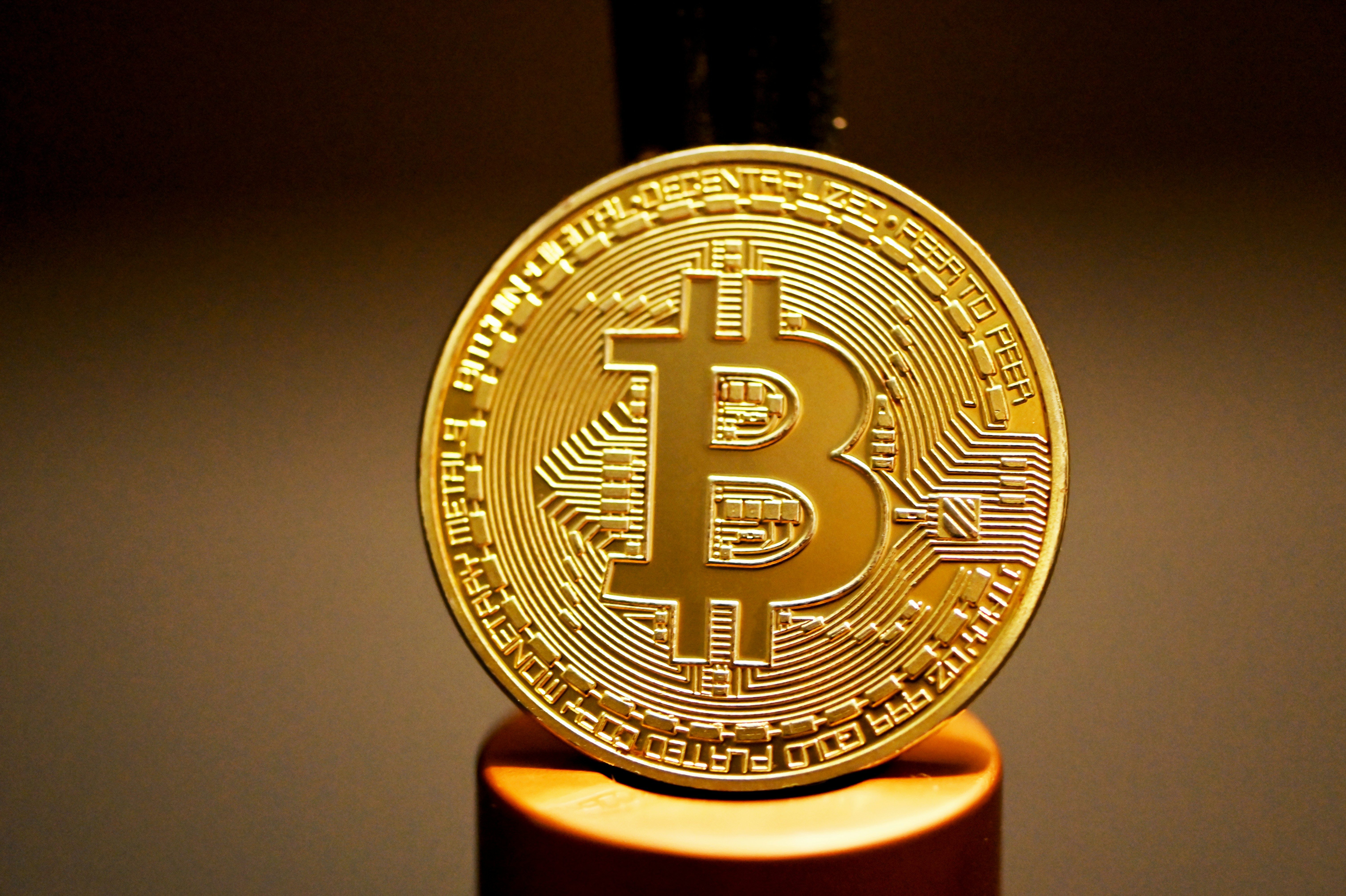 A bitcoin is shining in the dark