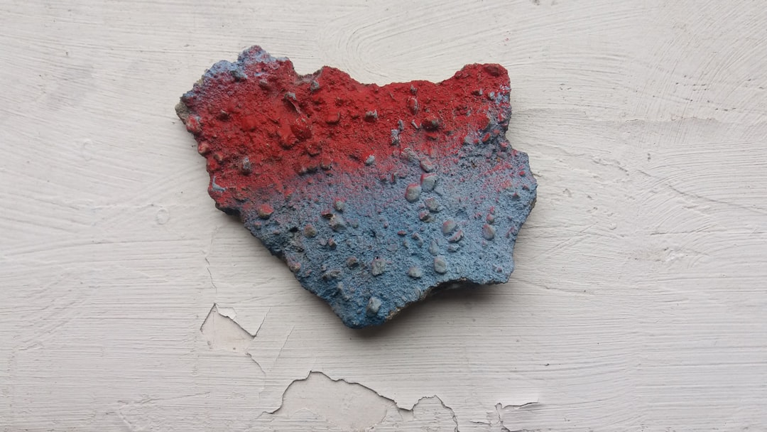 red and blue powder on white wooden table