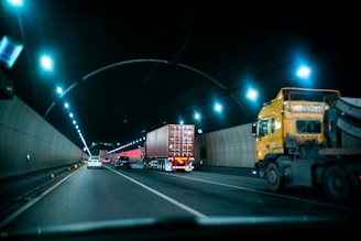 yellow truck on road during nighttime