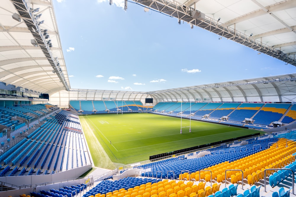 green and yellow stadium under blue sky during daytime