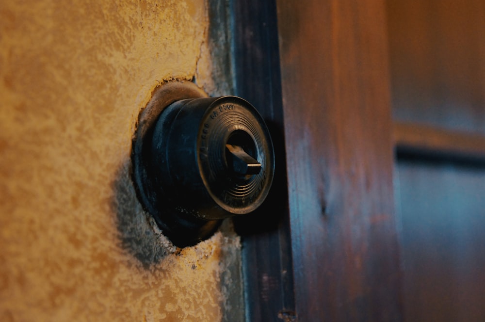 black round metal on brown wooden door