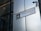 A street sign labeled 'HOUNDSDITCH EC3' is mounted on a modern building with reflective glass panels. The sign includes the City of London emblem. A security camera is positioned above the sign.