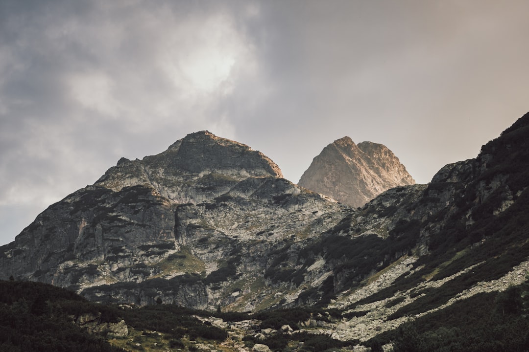 gray and white mountain under white cloudy sky during daytime