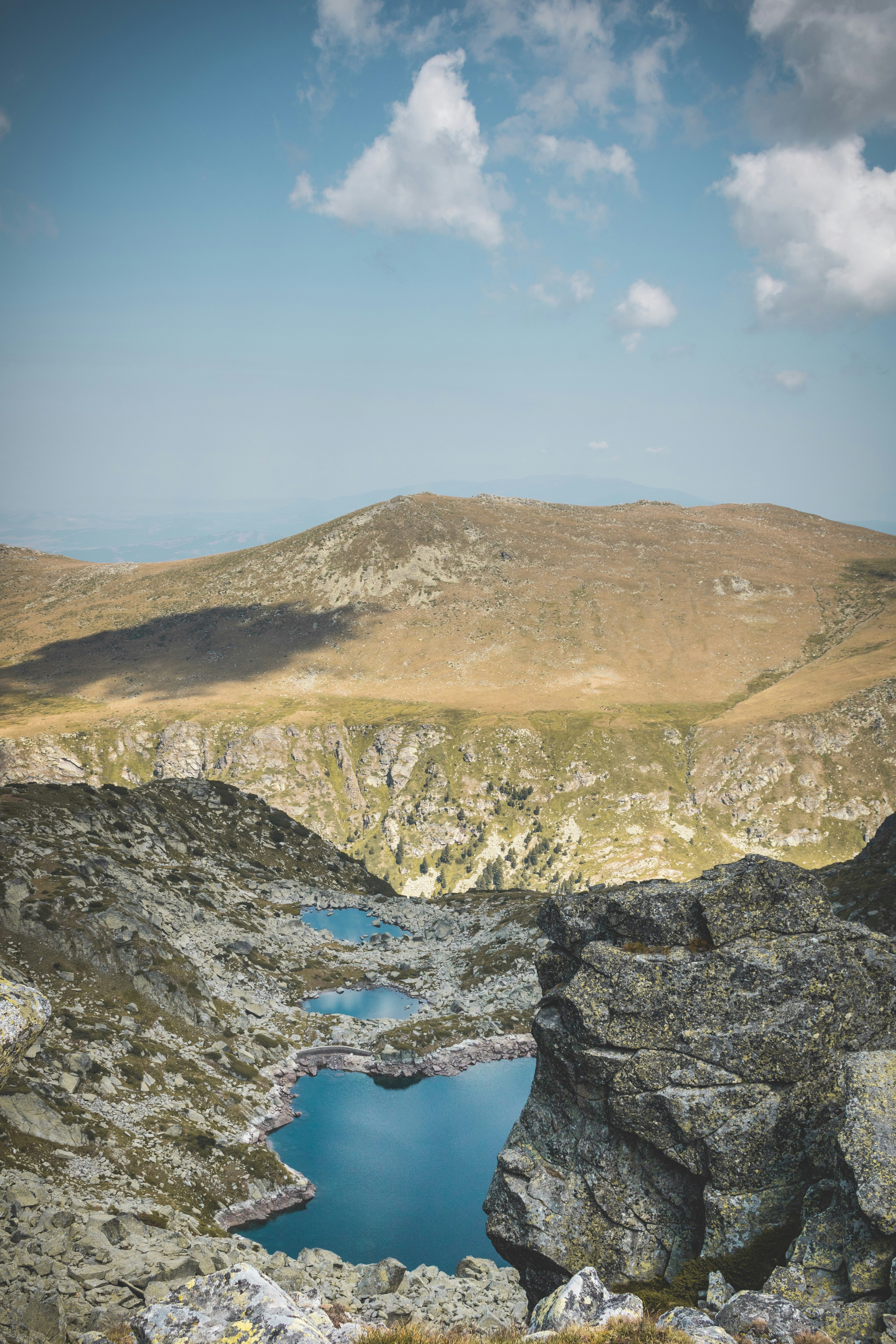 brown and green mountain under blue sky during daytime