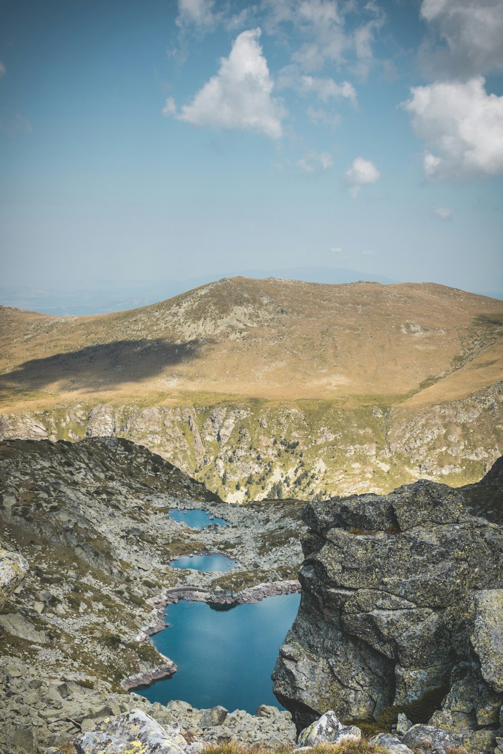 brown and green mountain under blue sky during daytime