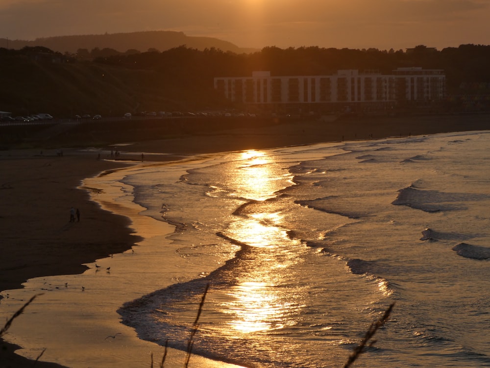 body of water during sunset