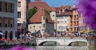 people walking on river near brown concrete building during daytime