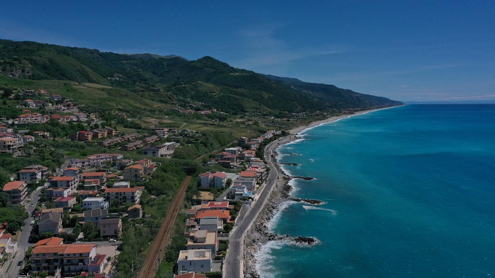 aerial view of city near body of water during daytime