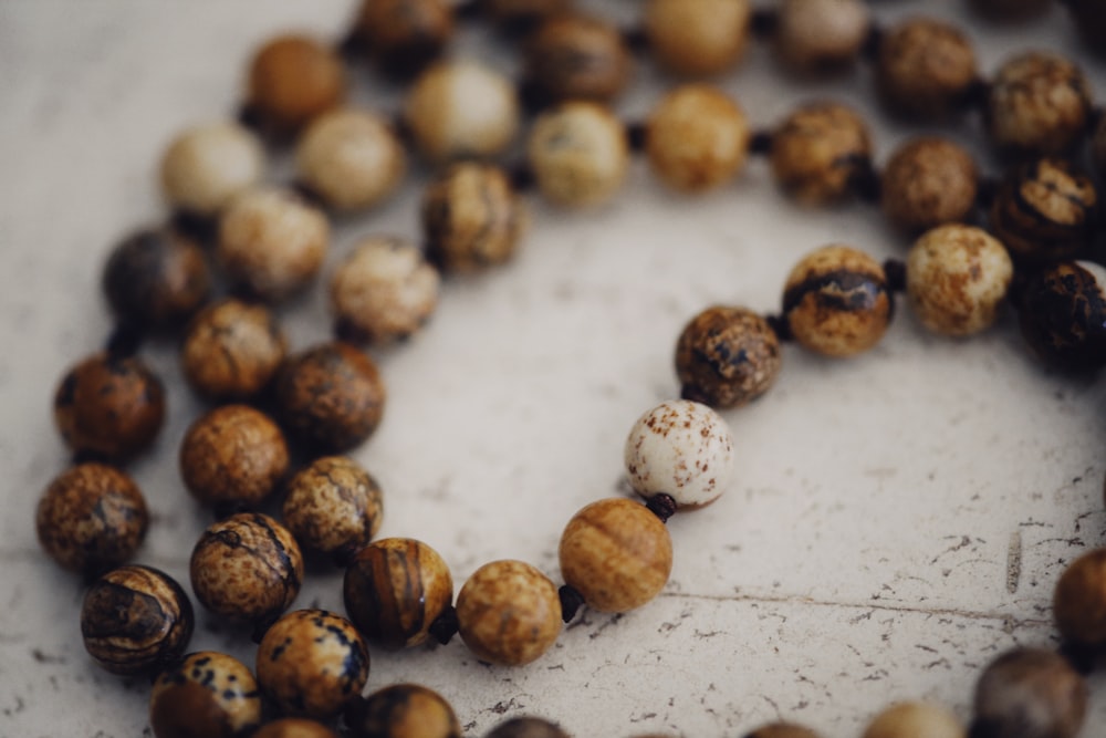 brown round fruits on white surface