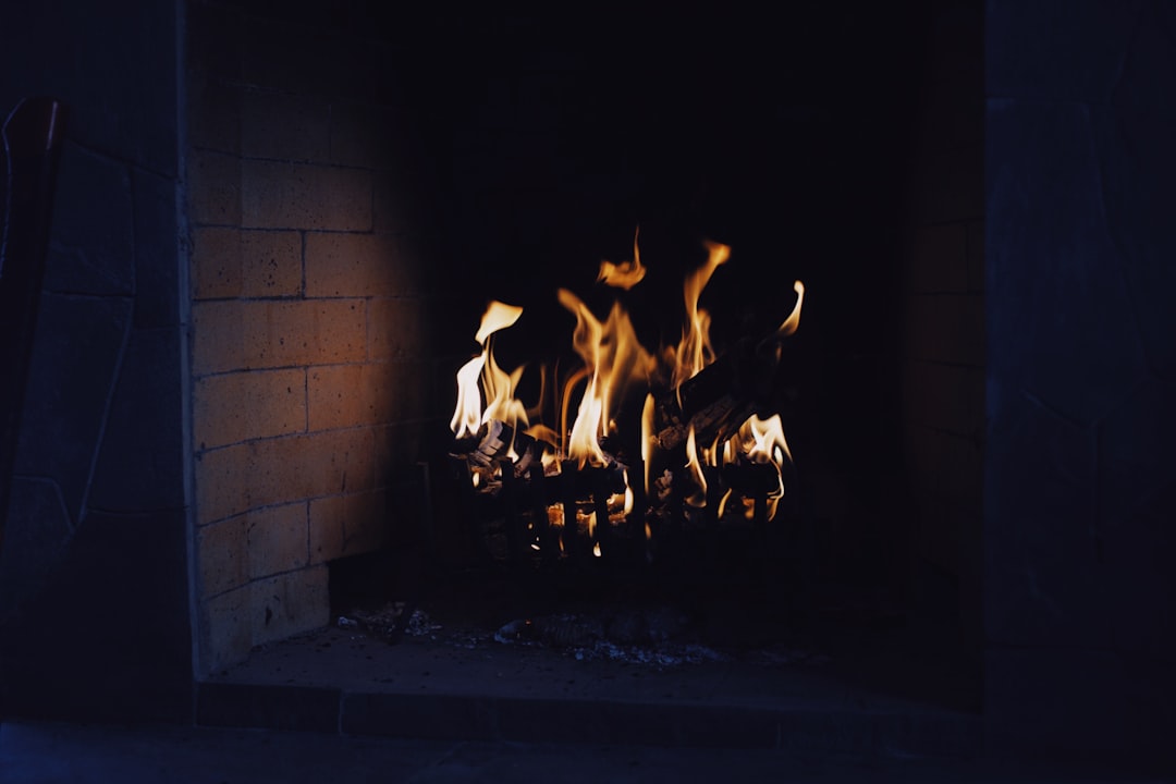 fire in front of brick wall