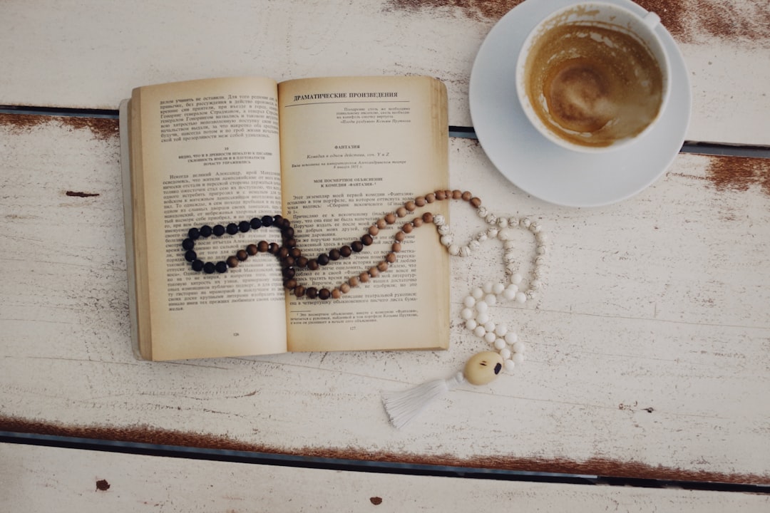 white ceramic mug on white book page