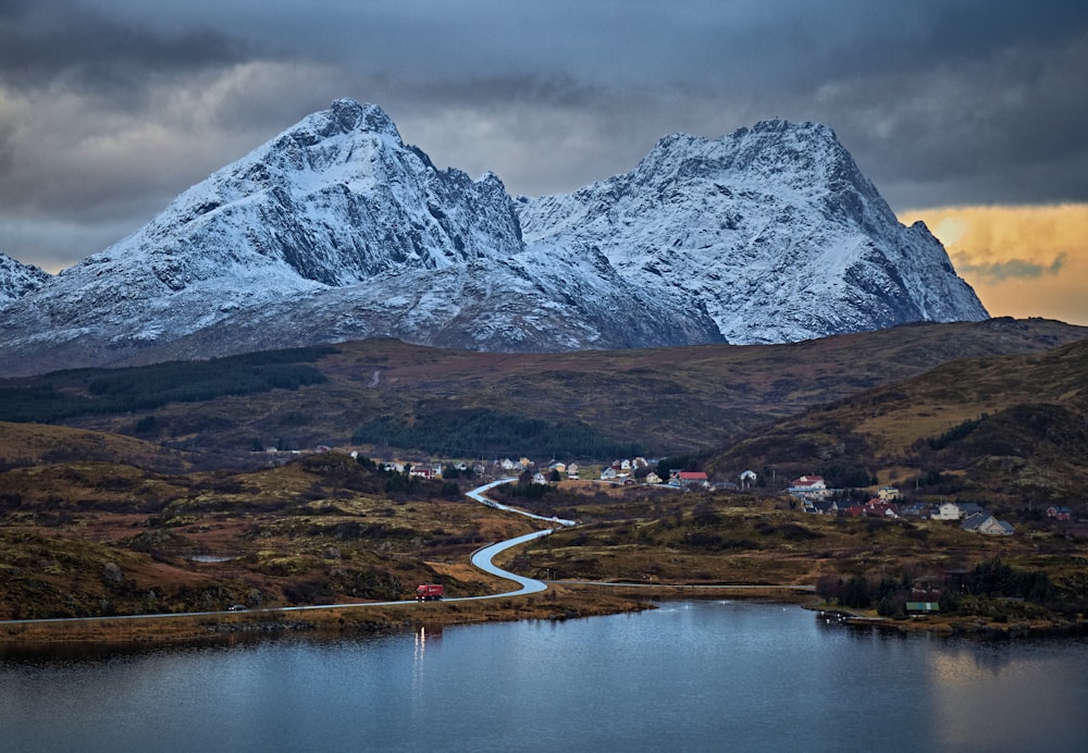 gray and white mountain near body of water during daytime