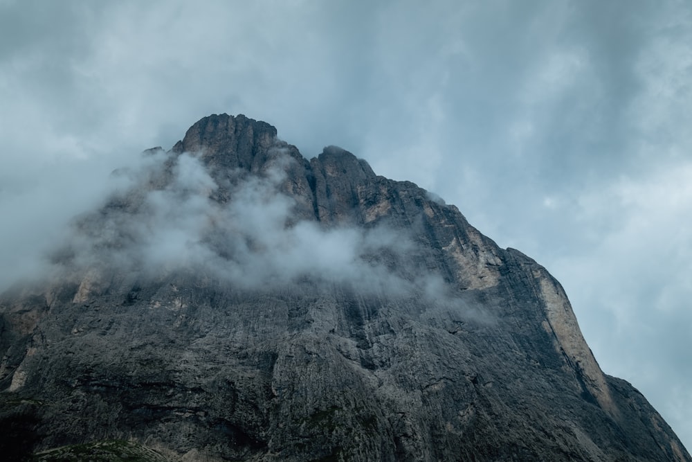 gray mountain under white clouds during daytime