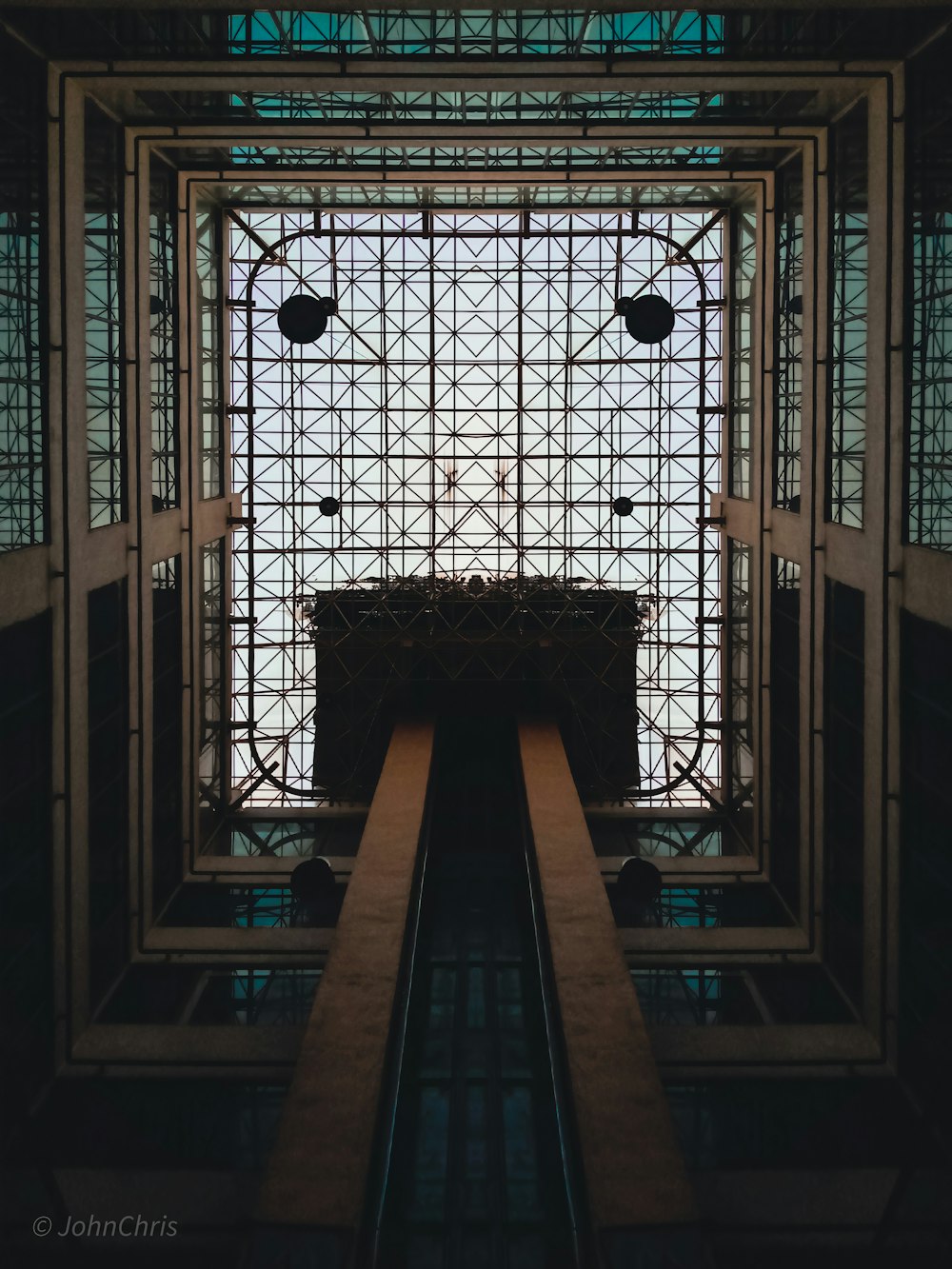 brown wooden table in the middle of a building