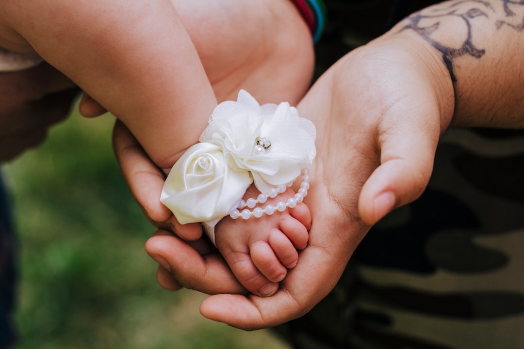 white rose on persons hand