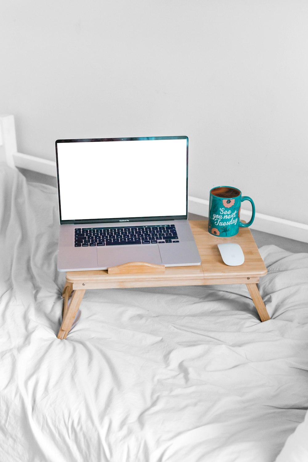 macbook air on brown wooden table