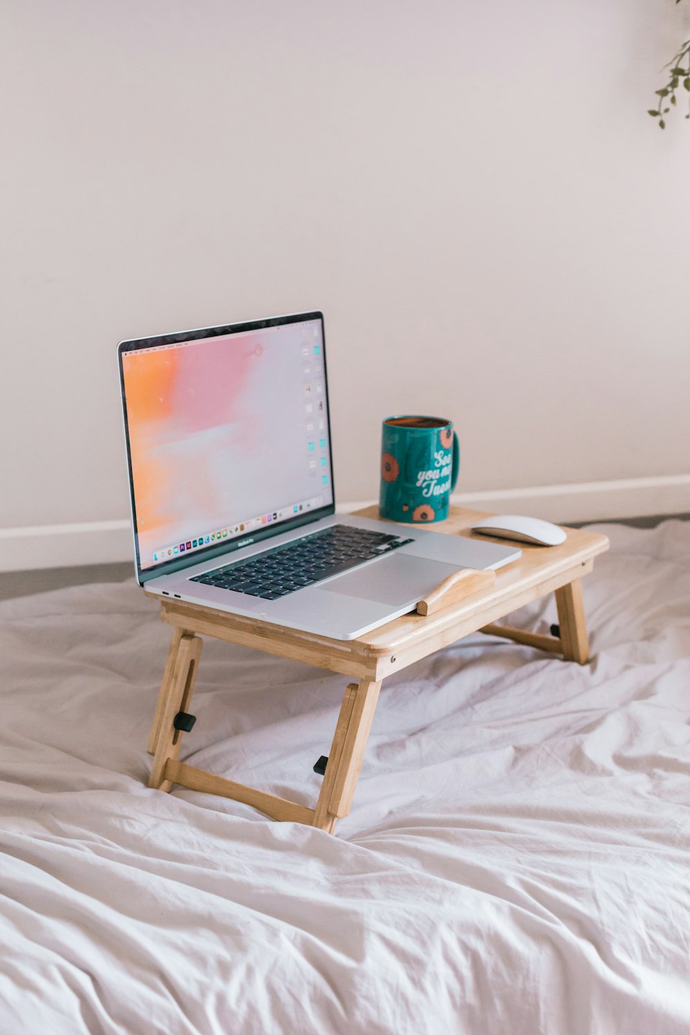 macbook pro on brown wooden table