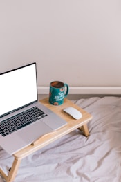 macbook pro on brown wooden table