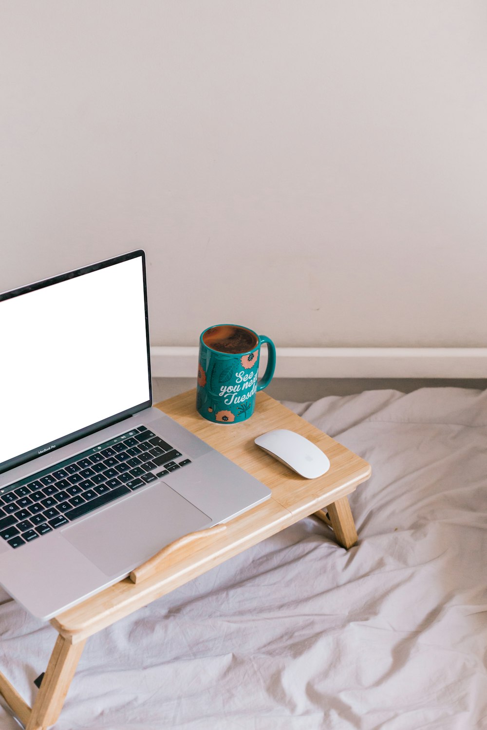 macbook pro on brown wooden table