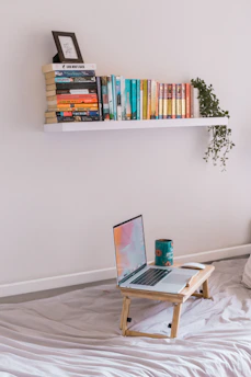 A cozy reading nook with a laptop open to a health blog article, surrounded by herbal teas and wellness books.