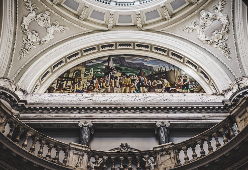 people in a building with glass windows