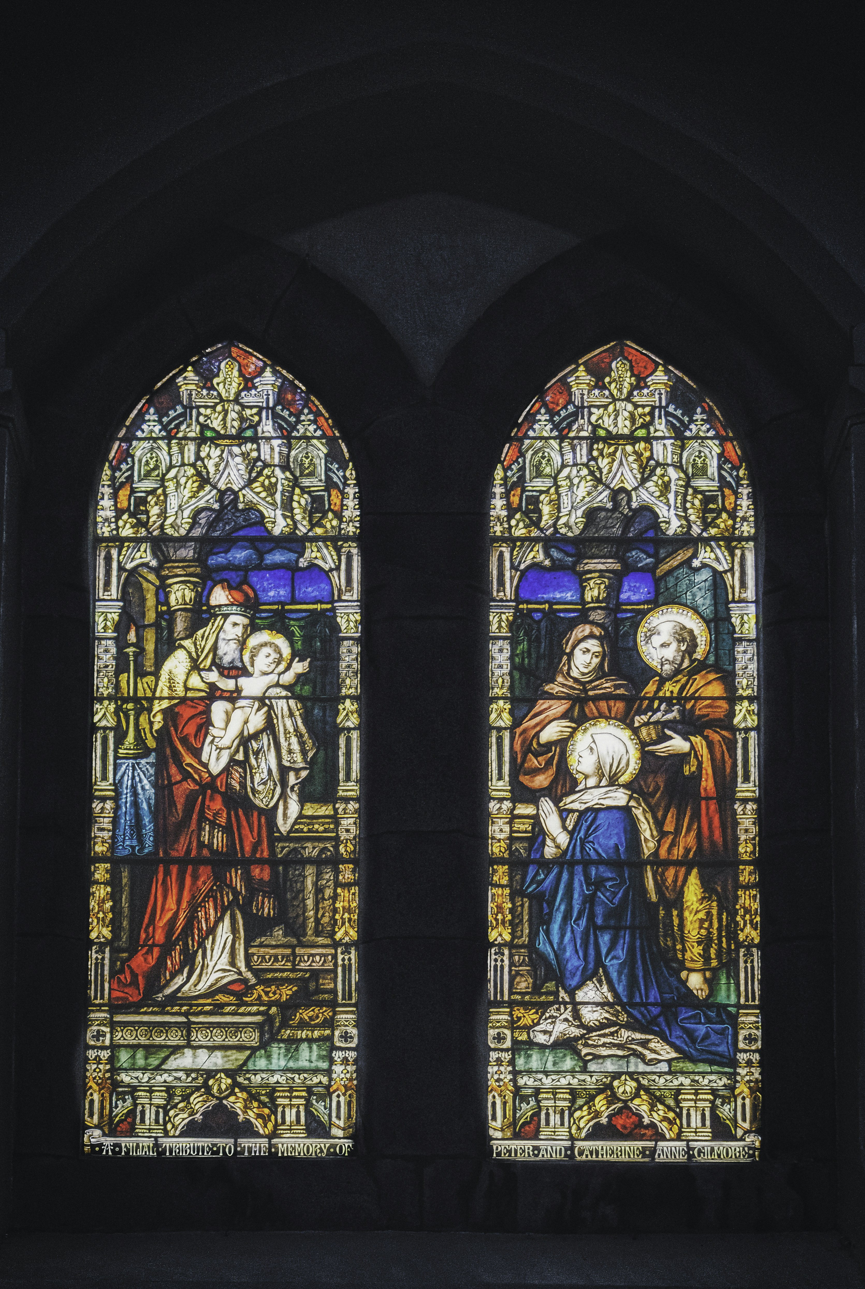 Stained glass windows representing "The presentation of the infant Jesus at Temple" from Luke 2:23-24 in St. Malachy's Church in Castlewellan, County Down (Sep., 2020).