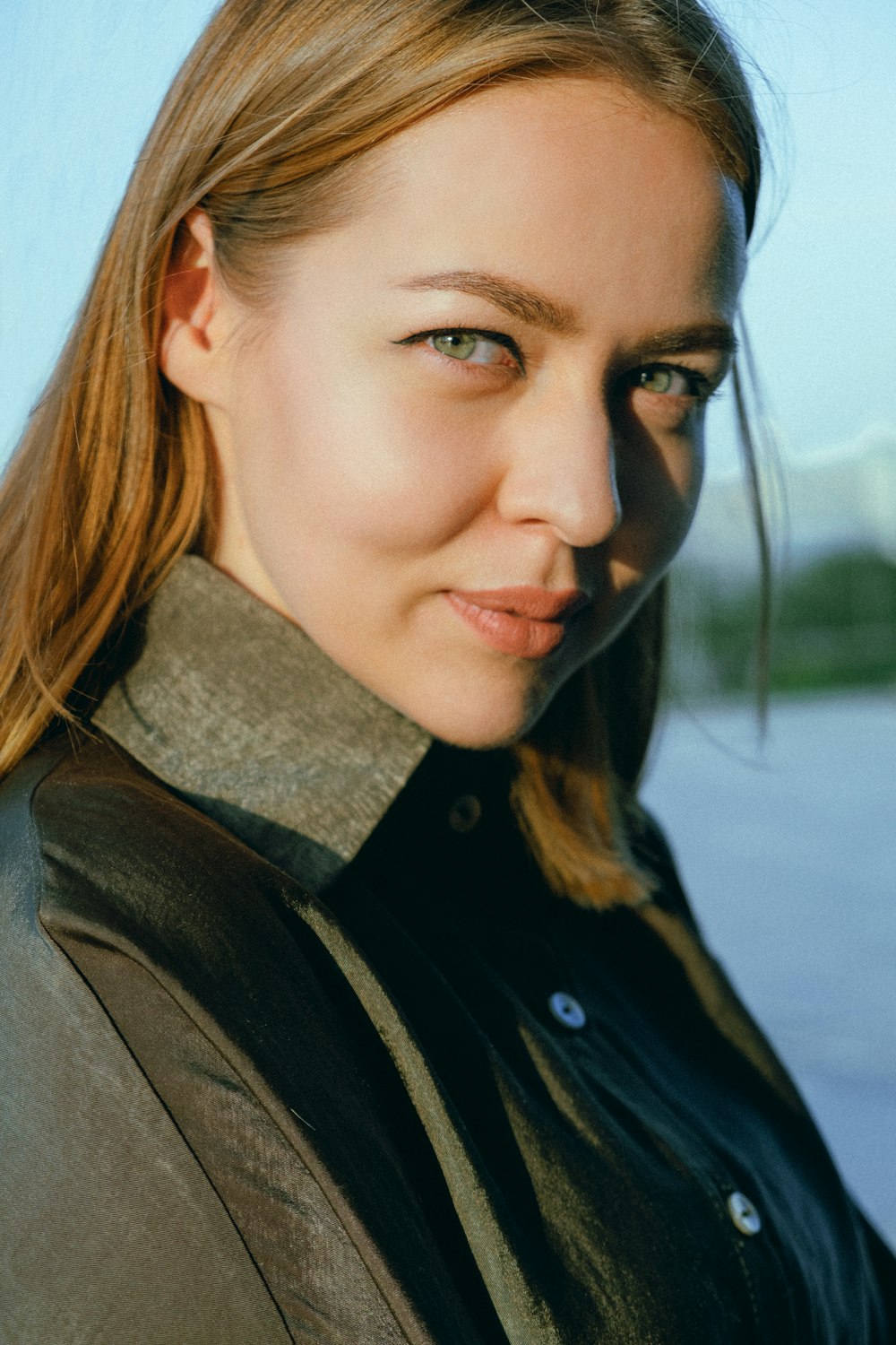 woman in black jacket and gray scarf