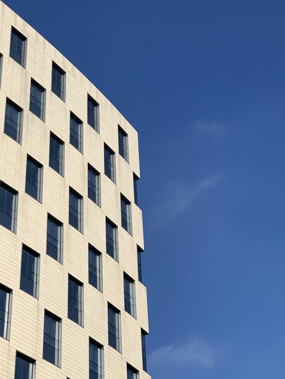 white concrete building under blue sky during daytime