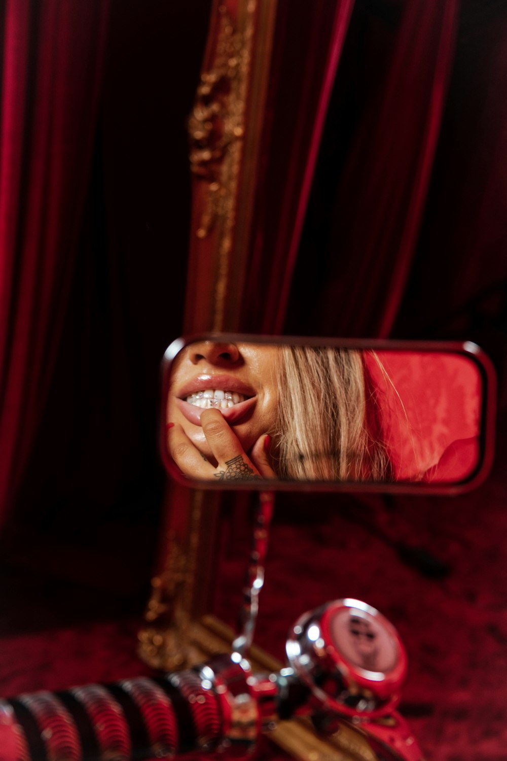 woman in red lipstick taking selfie