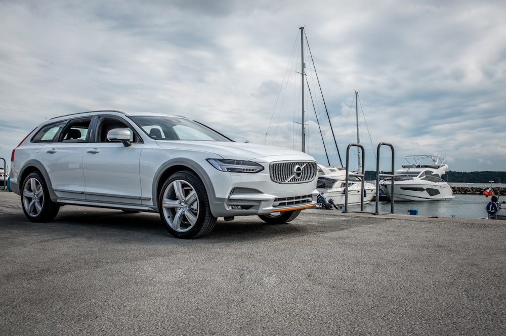 silver mercedes benz coupe parked on parking lot during daytime