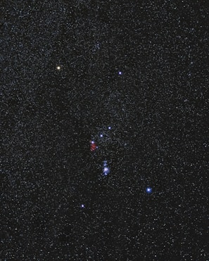 A colorful depiction of various constellations in the night sky.