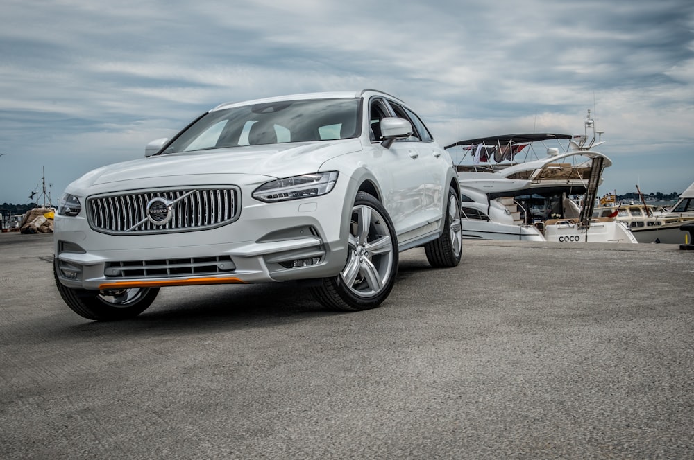 white mercedes benz coupe on gray asphalt road during daytime