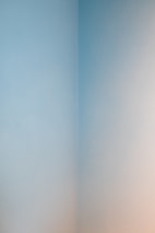 Finished drywall walls with smooth, clean corners in a modern home interior.