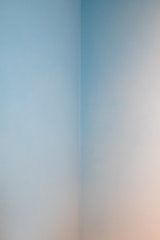 A freshly painted living room with smooth, even walls in a soft neutral tone.