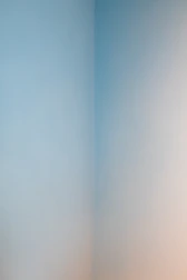 Freshly painted wall with even, smooth finish in a bright room.