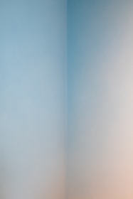 Close-up of a living room wall with flawless paint finish and subtle color blending.