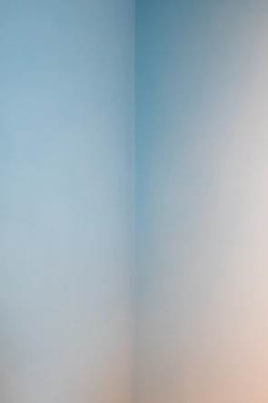 Smooth, freshly painted drywall corner with clean patchwork.