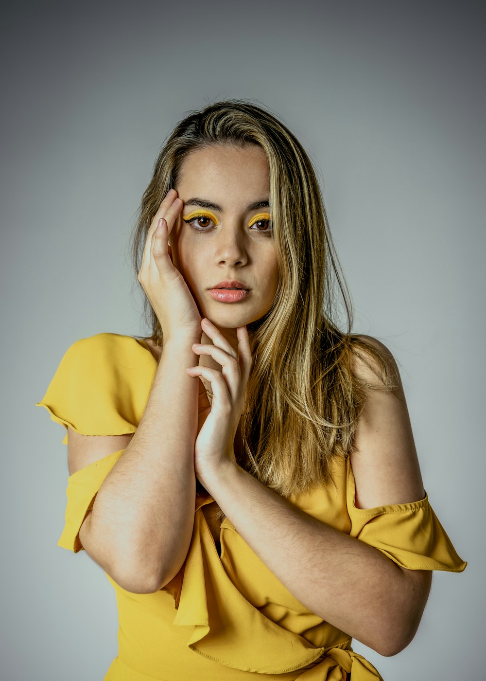 woman in yellow sleeveless dress