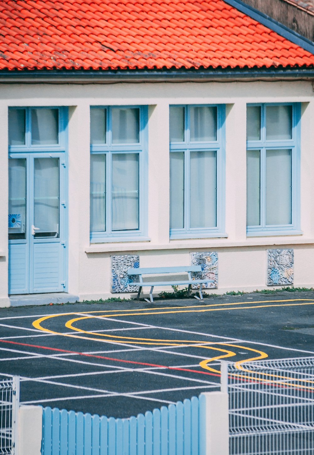 man in black shirt sitting on bench in front of window