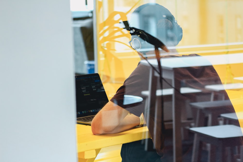 black and gray backpack on yellow chair