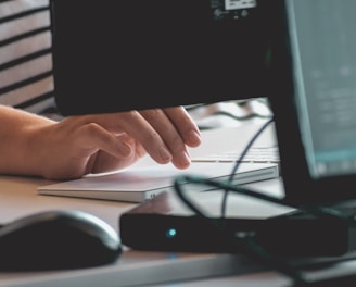 person using computer on table