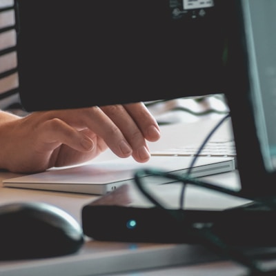 person using computer on table